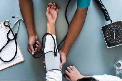 Doctor measuring patient's blood pressure